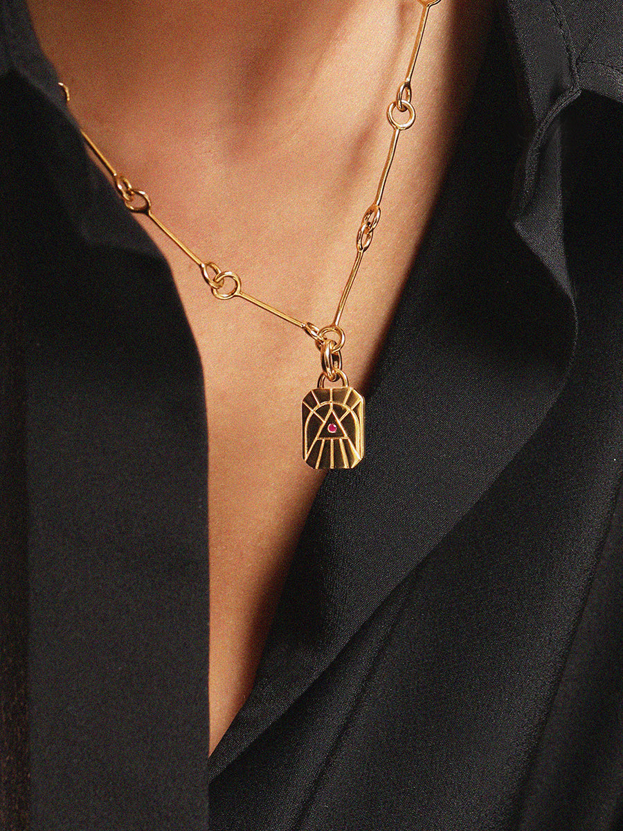 Gold Elements Fire Sign and Ruby Gemstone Pendant