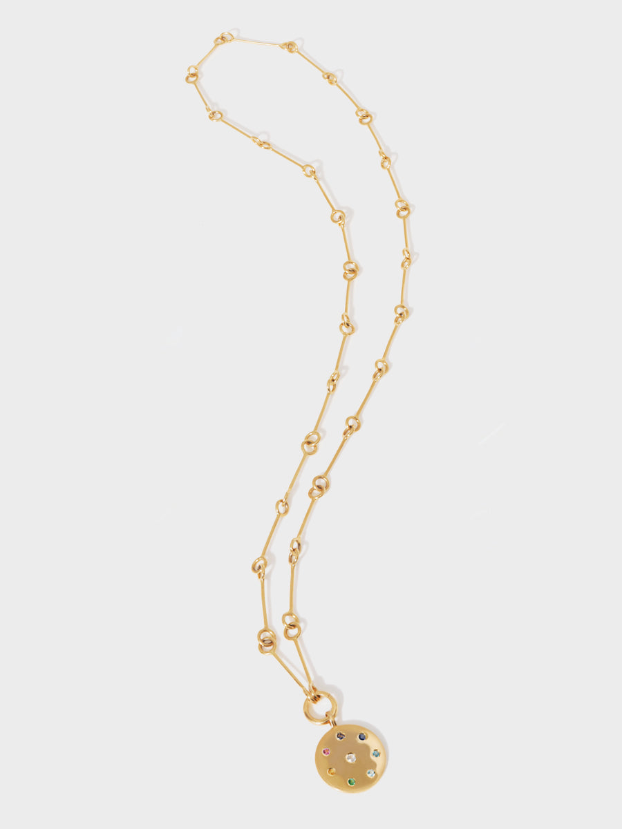 A long gold 26 inch link chain with a gold multi gemstone pendant with 8 different coloured stones set in a circle and one centrally