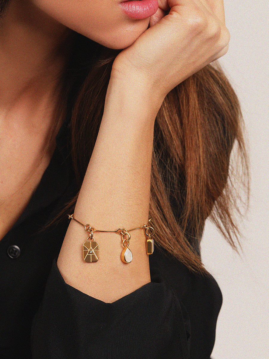 Gold Elements Fire Sign and Ruby Gemstone Pendant
