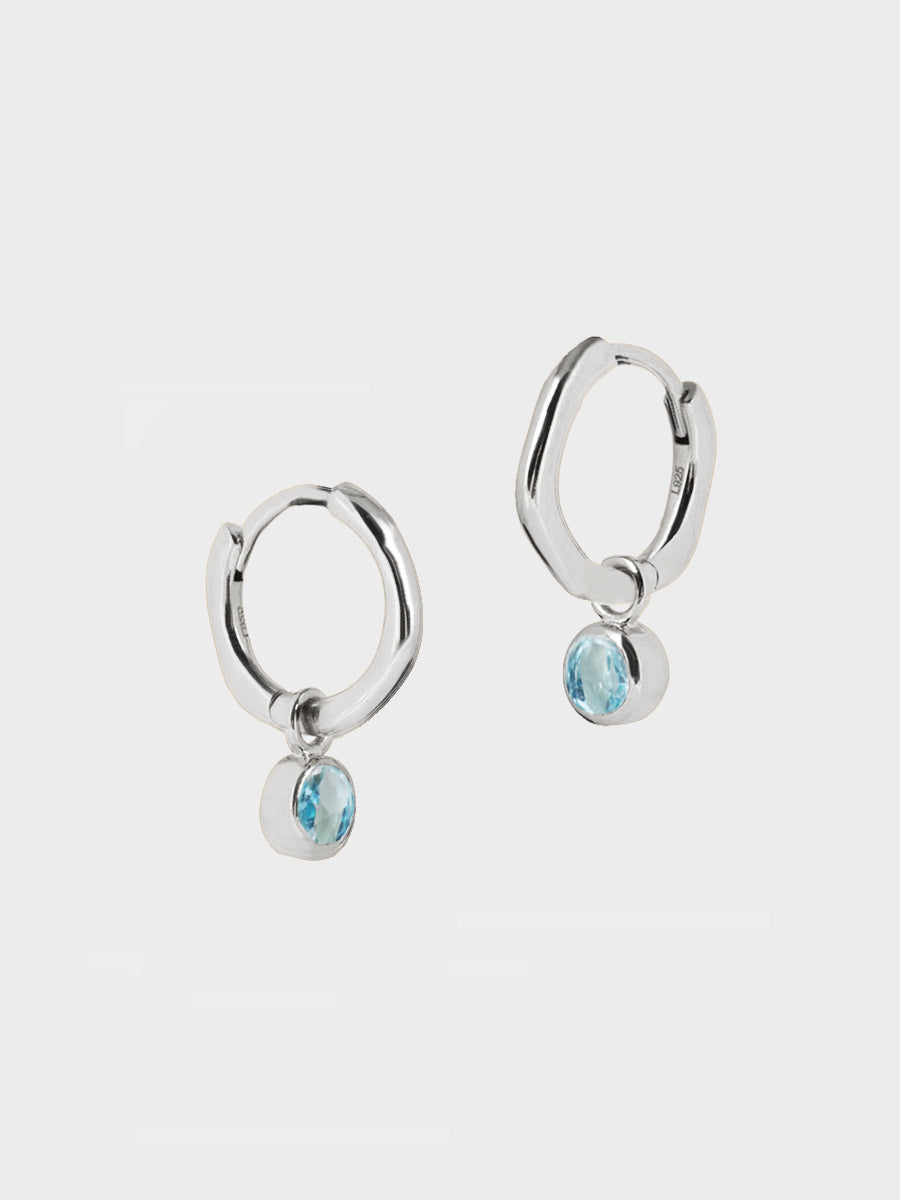 Sterling Silver Birthstone Huggies March - Blue Topaz