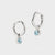 Sterling Silver Birthstone Huggies March - Blue Topaz