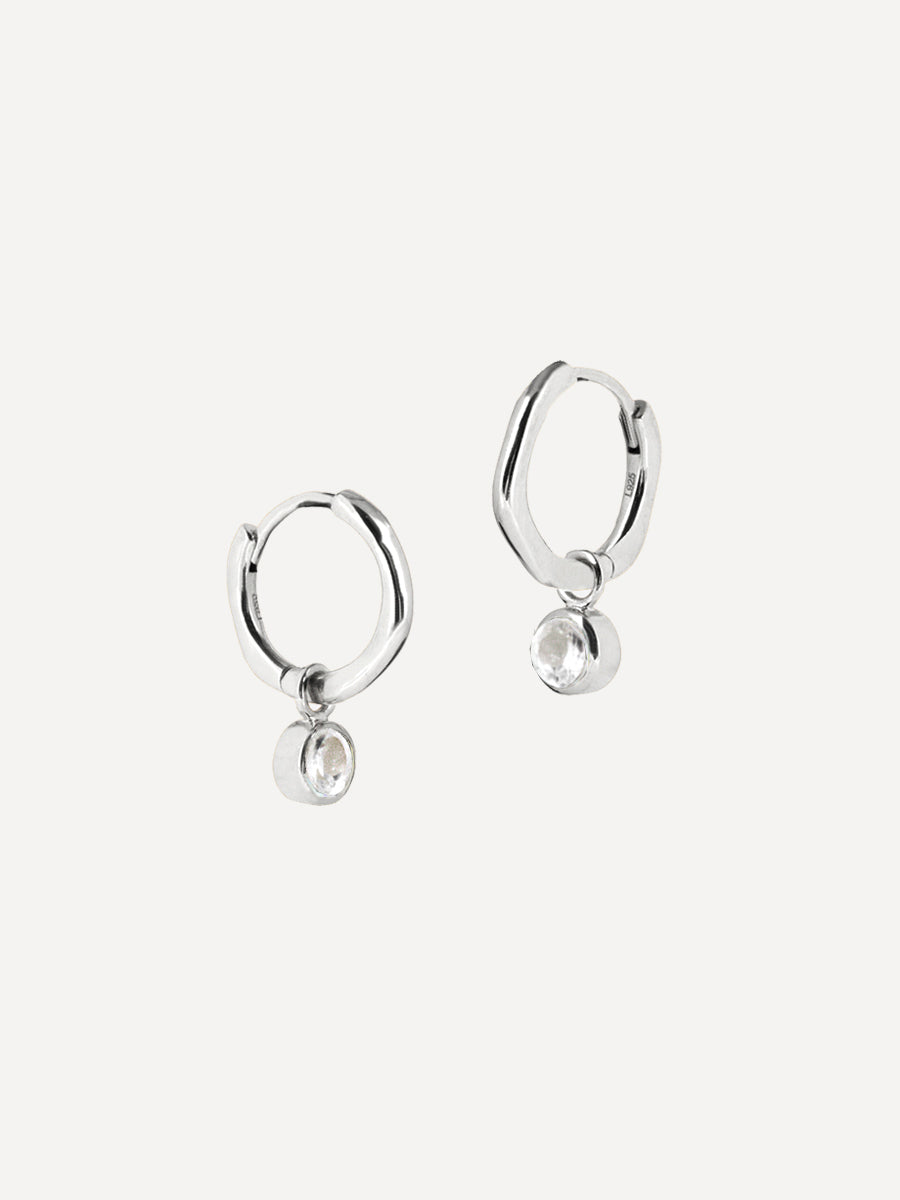 Sterling Silver Birthstone Huggies April - White Topaz
