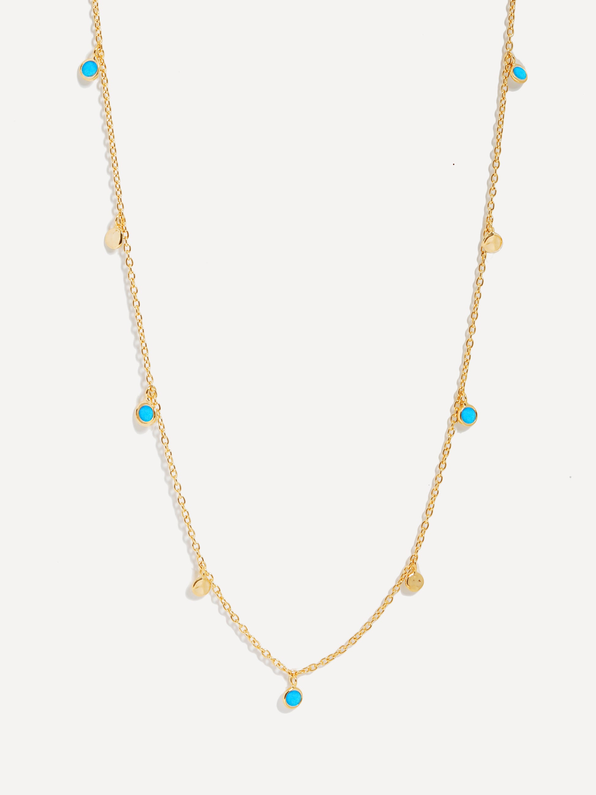 Collana con paillettes dorate e turchesi