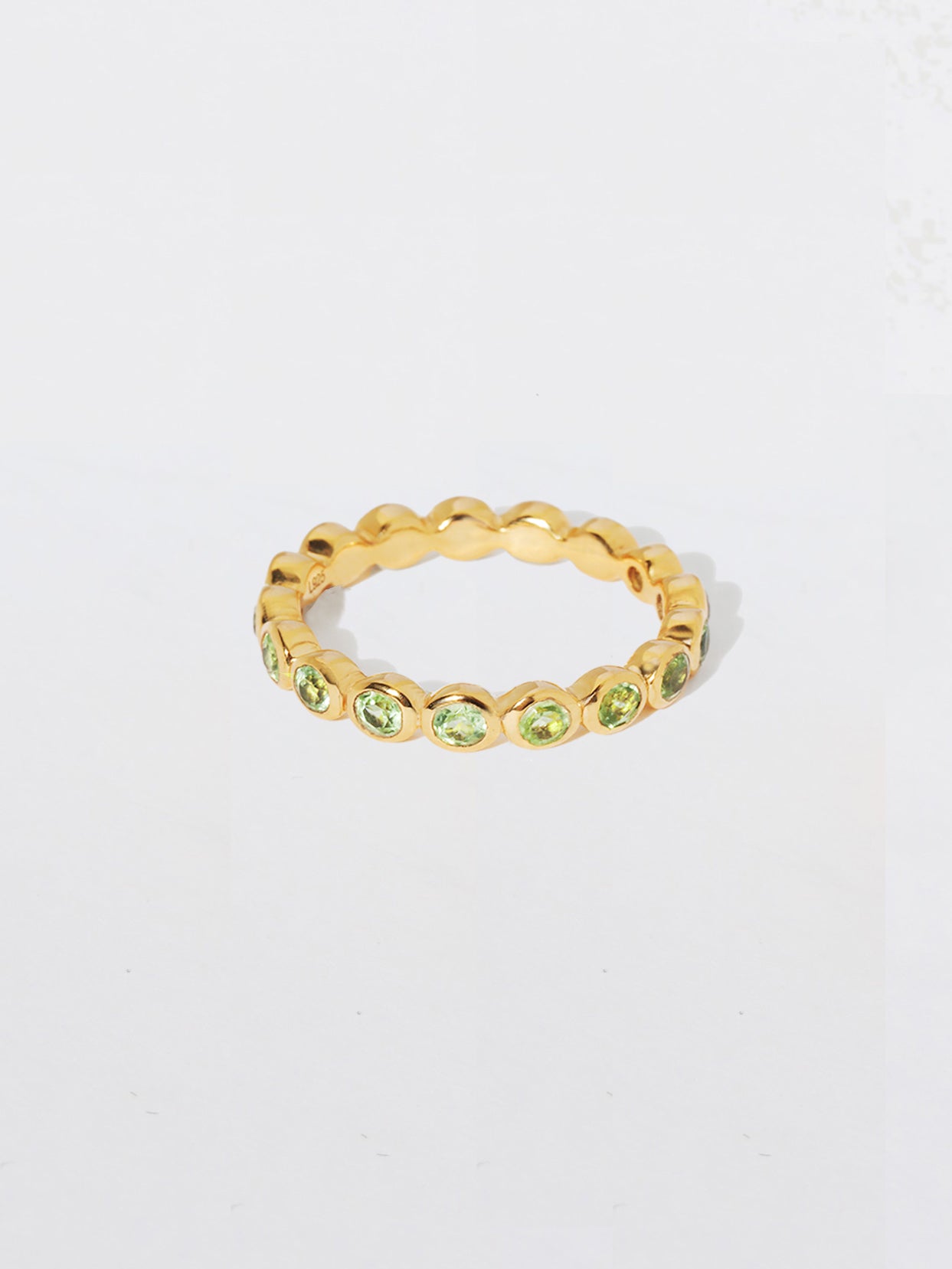 Orbit Gold Peridot Eternity Ring