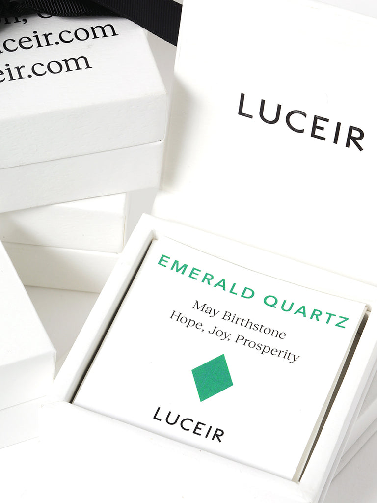 Luceir white packaging card set in a box saying Emerald Quartz, May Birthstone, Hope, Joy, Prosperity followed by an emerald green diamond symbol underneath with Luceir logo at the bottom