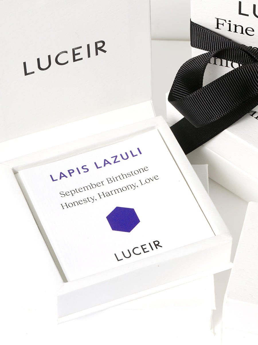 Luceir white packaging card set in a box saying Lapis Lazuli, September Birthstone, Honesty, Harmony, Love followed by a deep blue hexagon symbol underneath with Luceir logo at the bottom